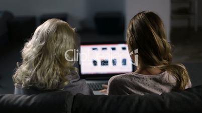 Women shoppping online on website using laptop