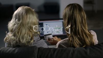 Women shopping online with laptop and credit card