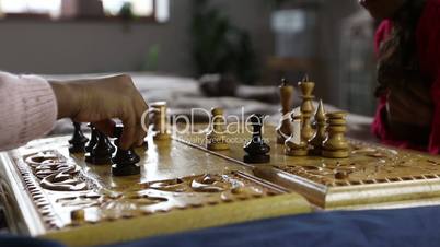 Chess game player making black rook move