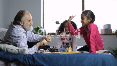 Girl choosing between black or white chess pieces