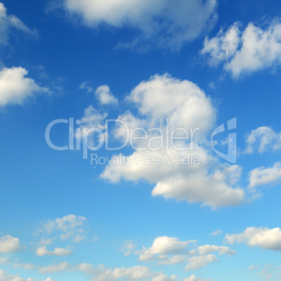 cumulus clouds in the blue sky