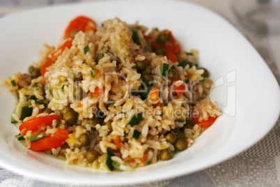 Rice, carrots, zucchini and peas