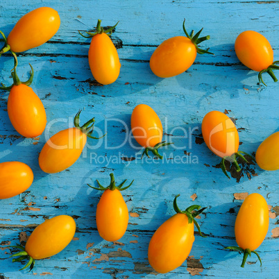 tomatoes on blue wooden surface