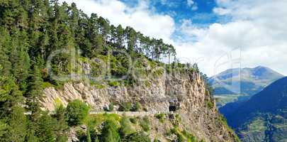 Mountains of Pyrenees, high-altitude road and tunnel.