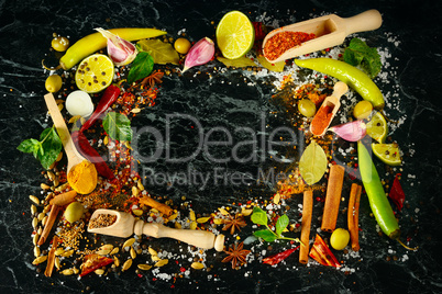 Variety of spices and herb on kitchen table.