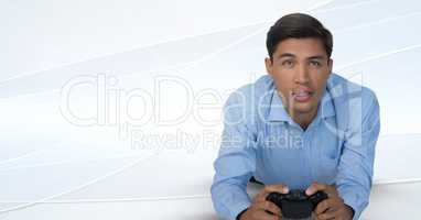 Businessman playing with computer game controller with bright background