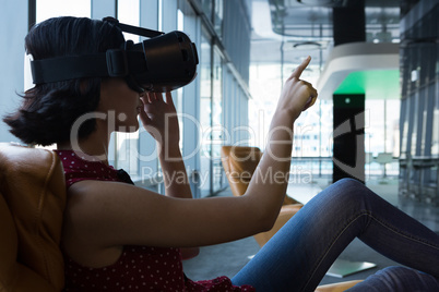 Female executive using virtual reality headset