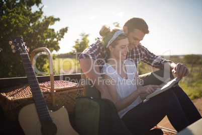 Couple relaxing in car on a sunny day