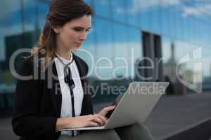 Female executive using laptop