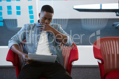 Male executive looking at documents