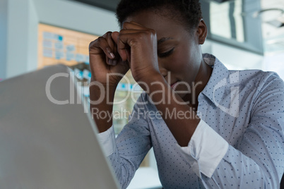 Female executive sitting in futuristic office