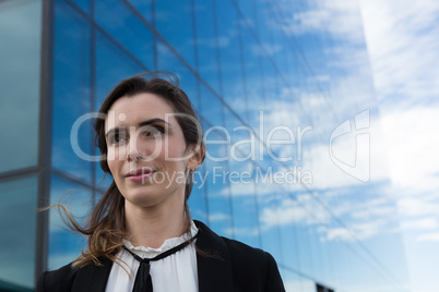 Female executive standing in office premises