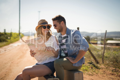 Couple looking at map on a sunny day