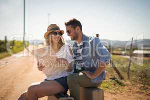 Couple looking at map on a sunny day