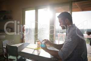 Man using digital tablet in restaurant