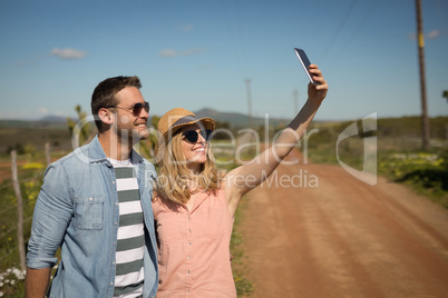 Couple taking selfie with mobile phone