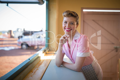 Waitress standing at counter in restaurant