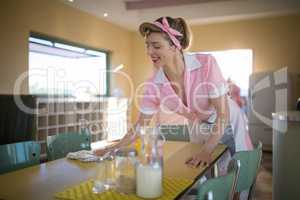 Waitress cleaning the table in restaurant