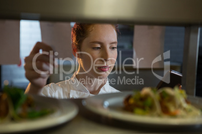 Female chef reading order