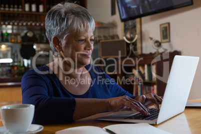 Waitress using laptop