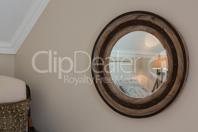 Wooden framed mirror on wall