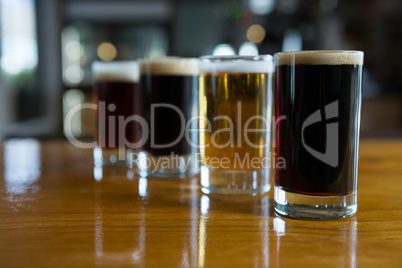 Close-up of beer glasses on the counter