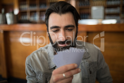 Man playing cards in bar