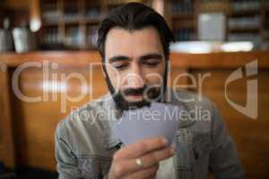 Man playing cards in bar