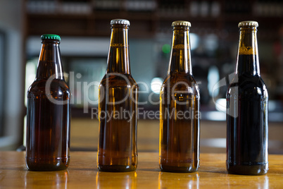 Arranged beer bottles on the bar counter