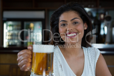 Woman holding beer glass