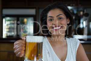 Woman holding beer glass