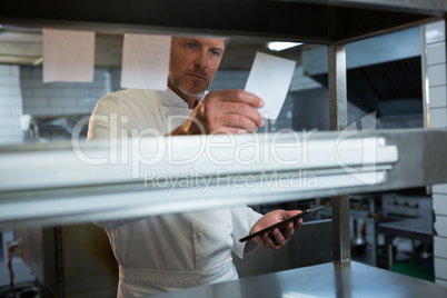 Male chef reading an order