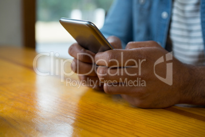 Man using mobile phone in cafÃ?Â©