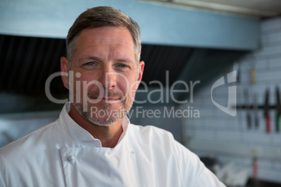 Male chef standing in commercial kitchen