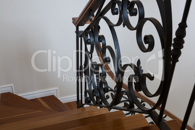 Interior wooden stairs with metal railing