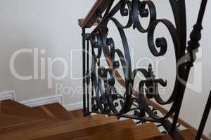 Interior wooden stairs with metal railing