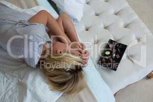 Woman sleeping peacefully on bed