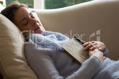 Woman sleeping peacefully on sofa