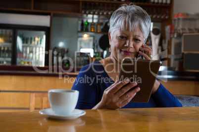 Waitress talking on his phone