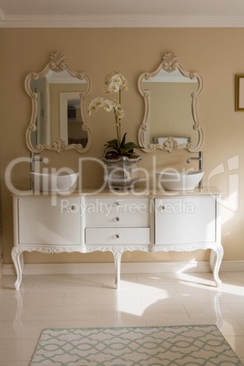 Elegant sink and mirror in bathroom