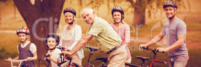 Portrait of happy family on bike