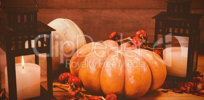 Pumpkins with candles on table during Halloween