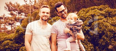 Happy gay couple with child