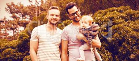 Happy gay couple with child