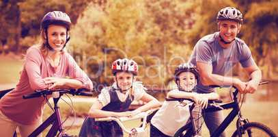 Happy family on bicycle at park