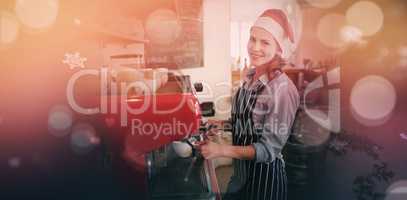 Composite image of portrait of happy waitress wearing santa hat