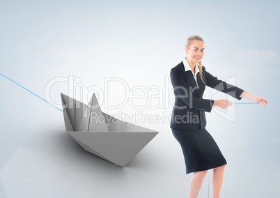 Businesswoman pulling paper boat with rope