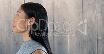 Woman looking forward with wooden background