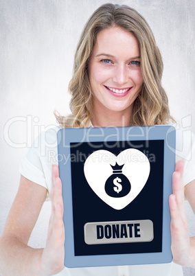 Woman holding tablet with donate button and money bag in heart