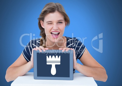 Woman holding tablet with clean brush icon